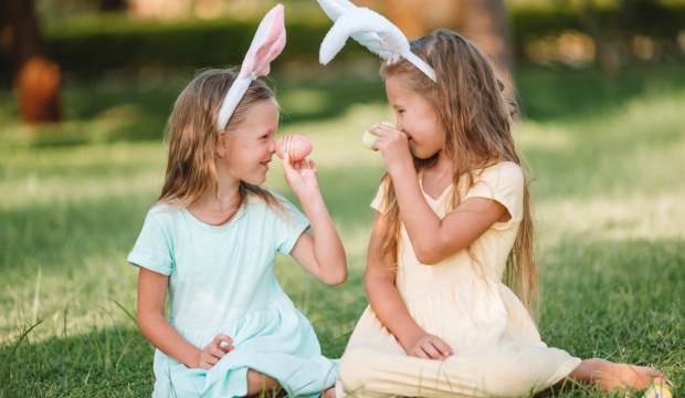 two young girls with easter eggs
