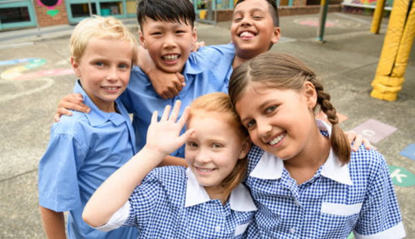 School kids smiling in uniform